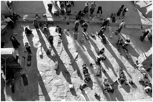 Praying at Barkhor Square Lhasa, Tibet