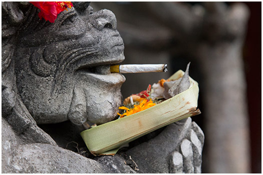 Cigaret smoking statue Bali, Indonesia